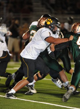 Arizona Doğu Vadisi oynanan bir normal sezon oyunları sırasında lise futbol oyun eylem. Yüksek okul futbol lise takım Amerika Birleşik Devletleri'nde oynadığı ızgara futbolcu.