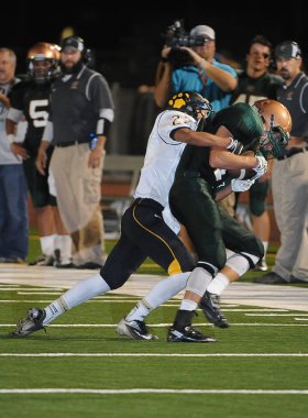 Arizona Doğu Vadisi oynanan bir normal sezon oyunları sırasında lise futbol oyun eylem. Yüksek okul futbol lise takım Amerika Birleşik Devletleri'nde oynadığı ızgara futbolcu.