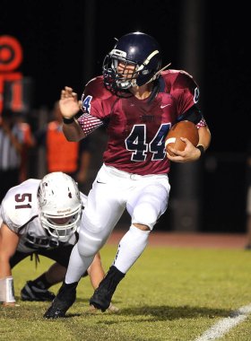 Arizona Doğu Vadisi oynanan bir normal sezon oyunları sırasında lise futbol oyun eylem. Yüksek okul futbol lise takım Amerika Birleşik Devletleri'nde oynadığı ızgara futbolcu.