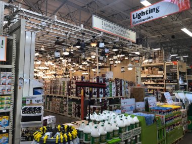 Home Depot is the largest Home Improvement Retailer in the United States. The painting department with a variety of paints and supplies being sold for customers to buy. Photo was taken in Gilbert Arizona located in the South West section of the US