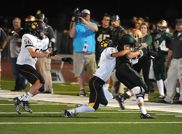 Arizona Doğu Vadisi oynanan bir normal sezon oyunları sırasında lise futbol oyun eylem. Yüksek okul futbol lise takım Amerika Birleşik Devletleri'nde oynadığı ızgara futbolcu.