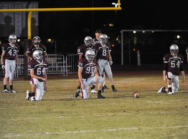 Arizona Doğu Vadisi oynanan bir normal sezon oyunları sırasında lise futbol oyun eylem. Yüksek okul futbol lise takım Amerika Birleşik Devletleri'nde oynadığı ızgara futbolcu.