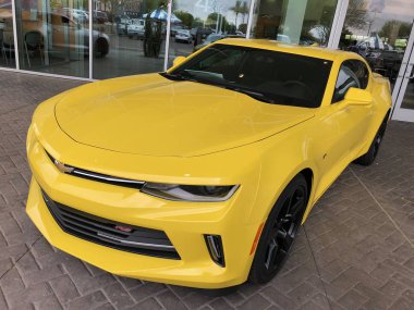  Chevrolet Camaro on display at a local car dealership located in Chandler Arizona which is located in the Southwest part of the United States. The Chevrolet Camaro is an American automobile manufactured by Chevrolet, classified as a pony car. clipart