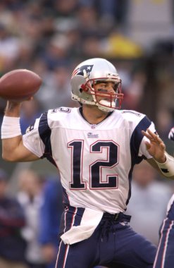 Tom Brady Quarterback Nfl sezonu sırasında oyun eylem New England Patriots için. Tom Brady New England Patriots Ulusal Futbol Ligi için bir Nfl futbol oyun kurucu olduğunu. Beş Super kase kazanmak için sadece iki oyuncu biri.