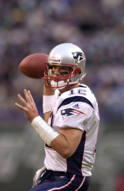 Tom Brady Quarterback for the New England Patriots in game action during the NFL season. Tom Brady is an NFL football quarterback for the New England Patriots of the National Football League. He is one of only two players to win five Super Bowls. clipart