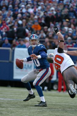 Eli Manning oyun kurucu için New York Giants normal sezon Nfl oyun sırasında oyun eylem. Eli Manning gelecek sezon için Super Bowl oyun kurucu için New York dev kazanan bir iki dönemdir.