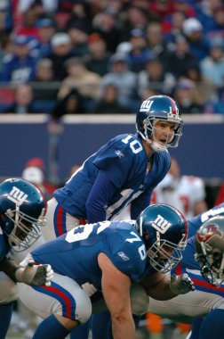 Eli Manning oyun kurucu için New York Giants normal sezon Nfl oyun sırasında oyun eylem. Eli Manning gelecek sezon için Super Bowl oyun kurucu için New York dev kazanan bir iki dönemdir.