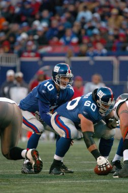 Eli Manning oyun kurucu için New York Giants normal sezon Nfl oyun sırasında oyun eylem. Eli Manning gelecek sezon için Super Bowl oyun kurucu için New York dev kazanan bir iki dönemdir.