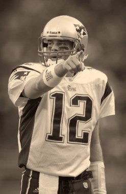Tom Brady Quarterback Nfl sezonu sırasında oyun eylem New England Patriots için. Tom Brady New England Patriots Ulusal Futbol Ligi için bir Nfl futbol oyun kurucu olduğunu. Beş Super kase kazanmak için sadece iki oyuncu biri.