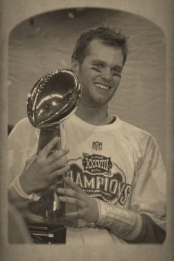 Tom Brady Quarterback Nfl sezonu sırasında oyun eylem New England Patriots için. Tom Brady New England Patriots Ulusal Futbol Ligi için bir Nfl futbol oyun kurucu olduğunu. Beş Super kase kazanmak için sadece iki oyuncu biri.