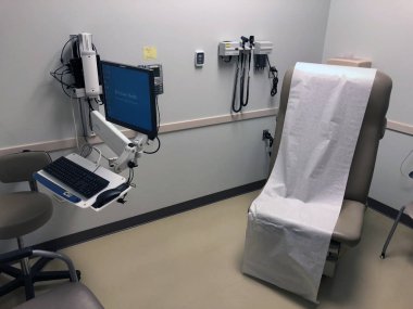 Afiş Md Anderson Kanser Merkezi ki hastaların kanser tedavileri için gidin. Bu merkezi Gilbert Arizona içinde yer alır. Doktorlar ve hastalar konuşmak için inceleyerek bir oda içinde görüntülemek.