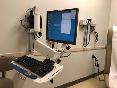 Afiş Md Anderson Kanser Merkezi ki hastaların kanser tedavileri için gidin. Bu merkezi Gilbert Arizona içinde yer alır. Doktorlar ve hastalar konuşmak için inceleyerek bir oda içinde görüntülemek.