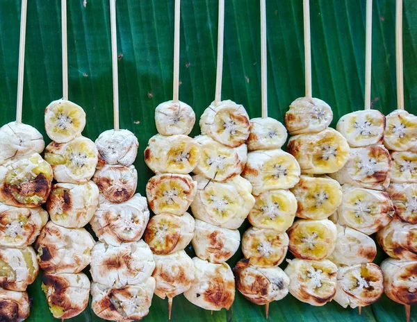 Banana stick grilled on banana leaf, Thai dessert
