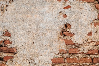 Arka plan için çatlamış çimentolu tuğla duvar