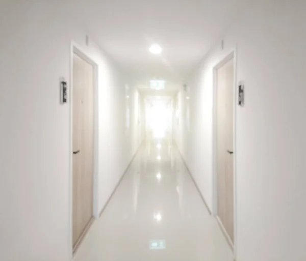 Abstract blurred of walkway with door in apartment
