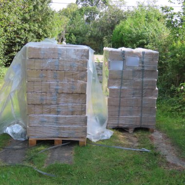 two pallets with firewood briquettes for heating in winter 960 k clipart