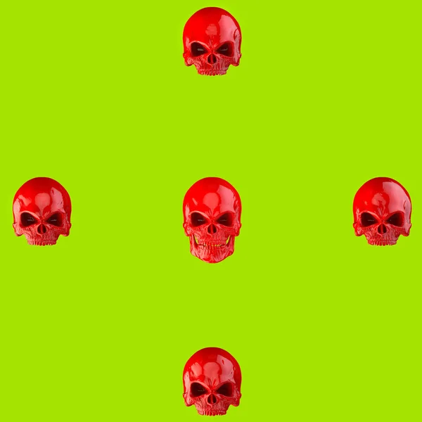 Red skulls on bright green background