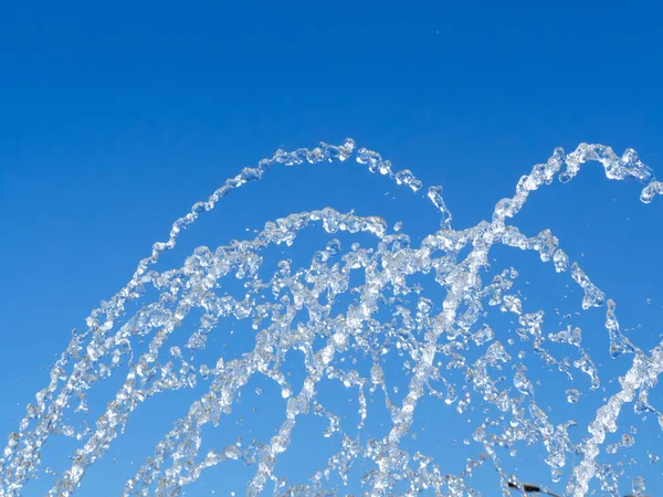 Water drops shooting up from the fountain