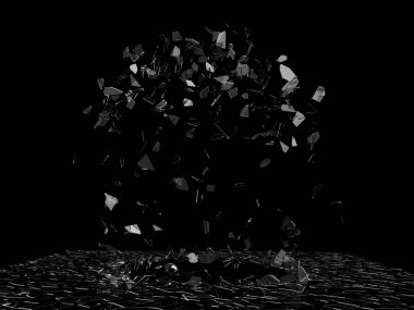 Patlayan cam parçaları havada uçuşuyor.