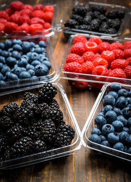 Assorted Berries on wood background — Stock Photo, Image