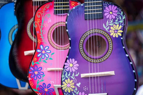A group of colorful painted mexican made guitars — Stock Photo, Image