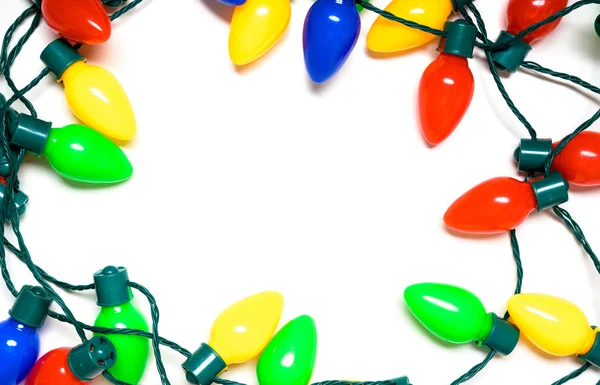 Colorful Christmas lights on a white background — Stock Photo, Image