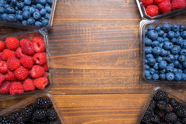 Assorted Berries on wood background — Stock Photo, Image