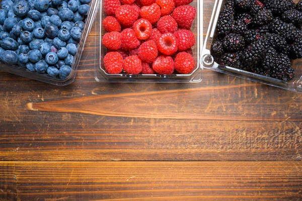 Assorted Berries on wood background — Stock Photo, Image