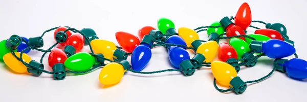 Colorful Christmas lights on a white background — Stock Photo, Image