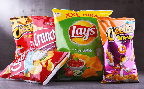 POZNAN, POLAND - JUN 15, 2018: Packets of popular brands of snack food including Lays, Crunchips and Cheetos