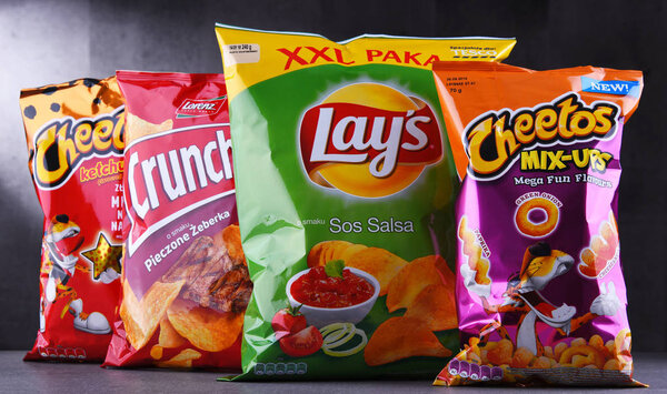 POZNAN, POLAND - JUN 15, 2018: Packets of popular brands of snack food including Lays, Crunchips and Cheetos