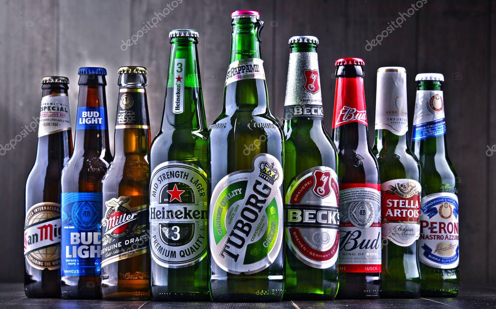 POZNAN, POL - JULY 19, 2018: Bottles of famous global beer brands including Heineken, Bud, Miller, Tuborg, Becks, Stella Artois, Peroni and San Miguel