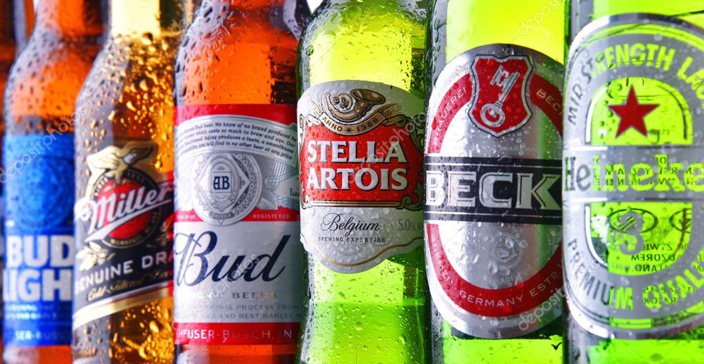POZNAN, POL - JULY 19, 2018: Bottles of famous global beer brands including Heineken, Bud, Miller, Tuborg, Becks, Stella Artois, Peroni and San Miguel