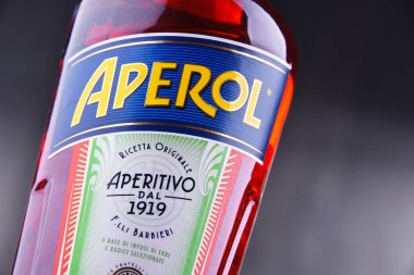 POZNAN, POL - JUL 20, 2018: Bottle of Aperol, an Italian aperitif made of gentian, rhubarb, and cinchona, It is produced by the Campari company. clipart