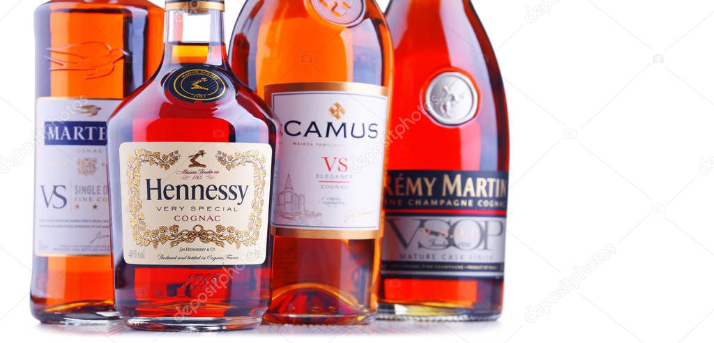 POZNAN, POL - SEP 27, 2018: Bottles of famous Cognac brands including Martell, Camus, Hennessy and Remy Martin.