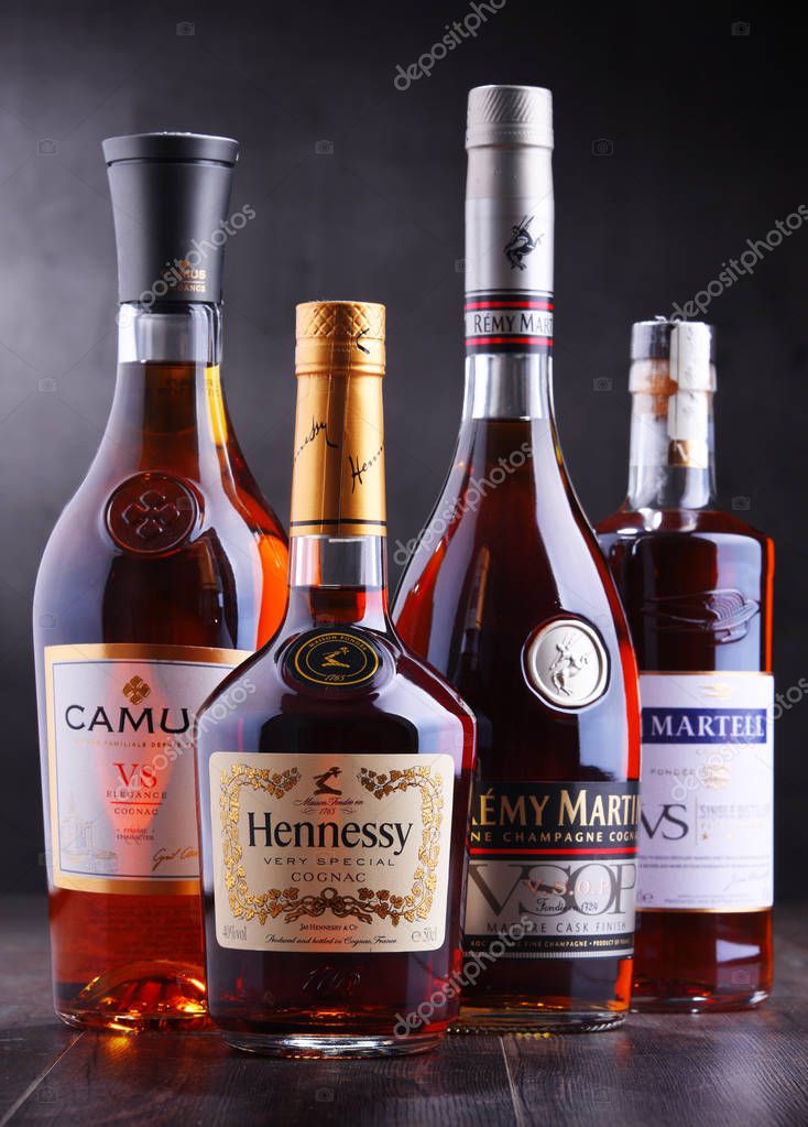 POZNAN, POL - SEP 27, 2018: Bottles of famous Cognac brands including Martell, Camus, Hennessy and Remy Martin.