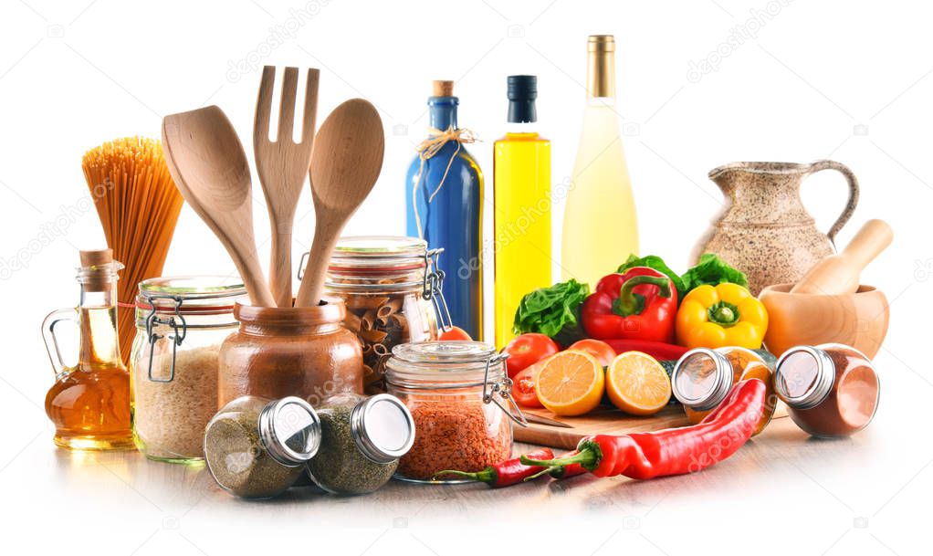 Assorted food products and kitchen utensils isolated on white background