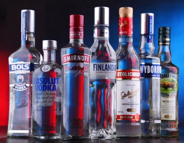 POZNAN, POLAND - NOV 15, 2018: Bottles of several global brands of vodka, the worlds largest internationally traded spirit with the estimated sale of about 500 million nine liter cases a year. clipart