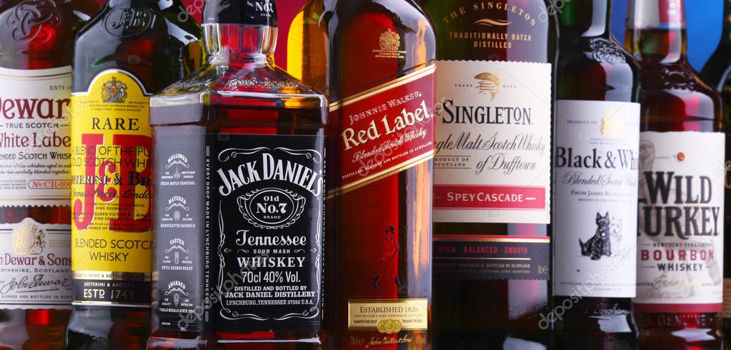 POZNAN, POLAND - NOV 16, 2018: Bottles of several global whiskey brands, the most popular liquor in the world.