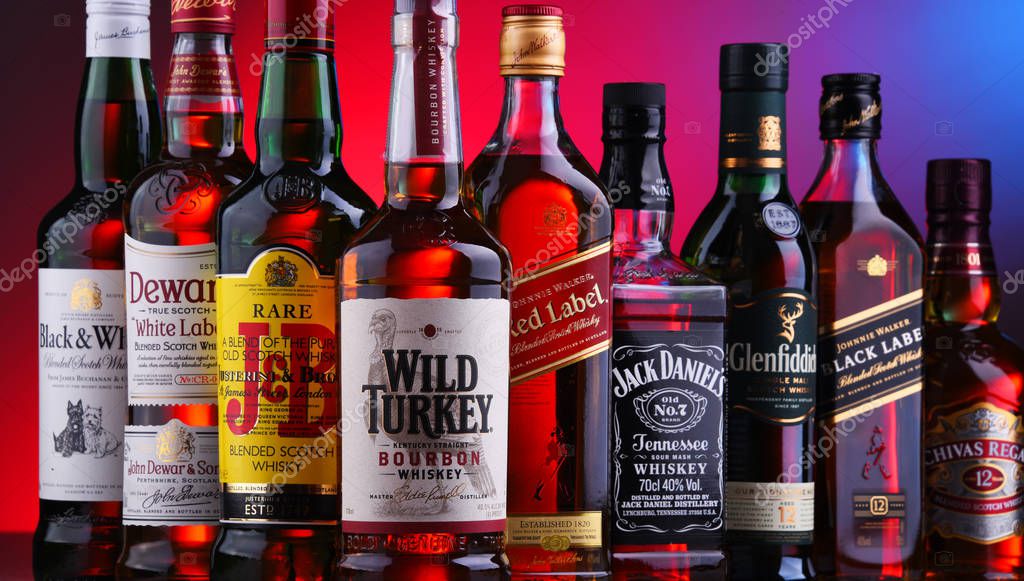 POZNAN, POLAND - NOV 16, 2018: Bottles of several global whiskey brands, the most popular liquor in the world.