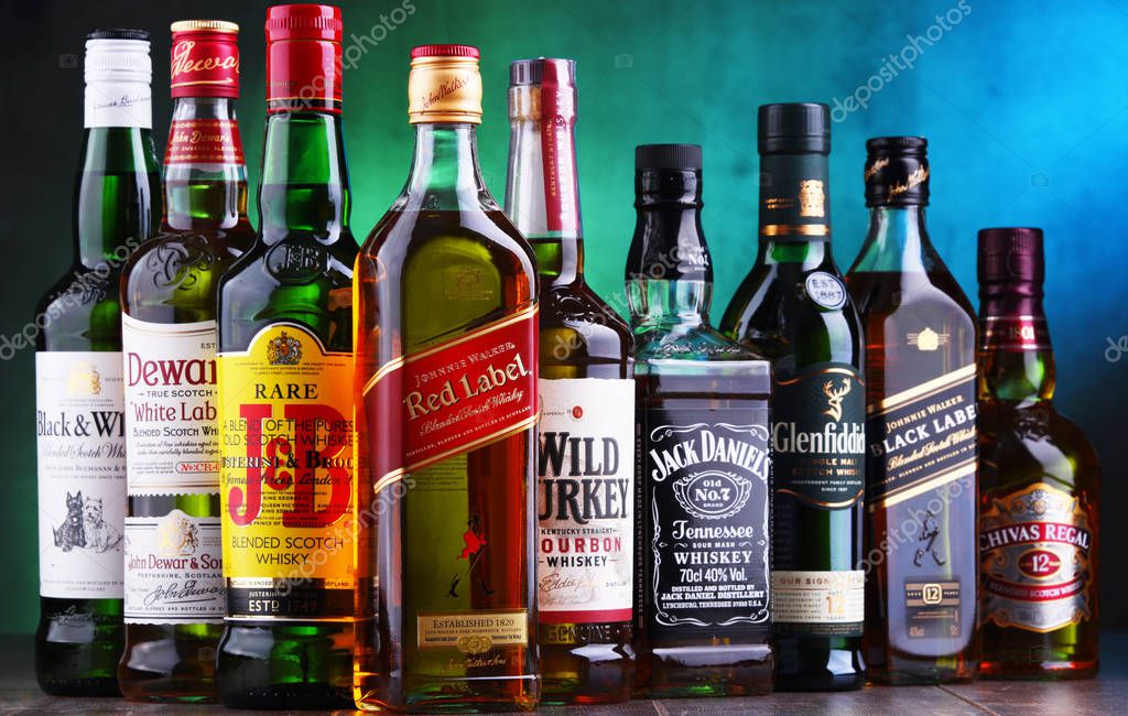 POZNAN, POLAND - NOV 16, 2018: Bottles of several global whiskey brands, the most popular liquor in the world.