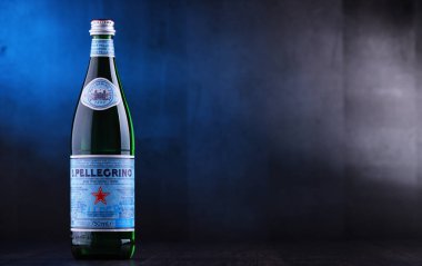 POZNAN, POL - JAN 24, 2019: Bottle of San Pellegrino, an Italian brand of mineral water made in the Province of Bergamo, Italy. Owned by Nestle since 1997. clipart