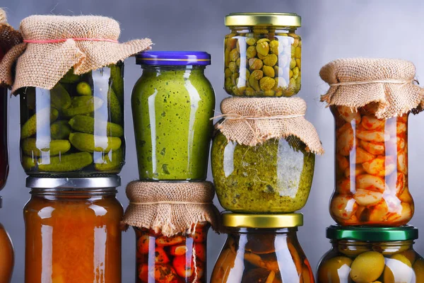 Jars with variety of pickled vegetables and fruits — Stock Photo, Image