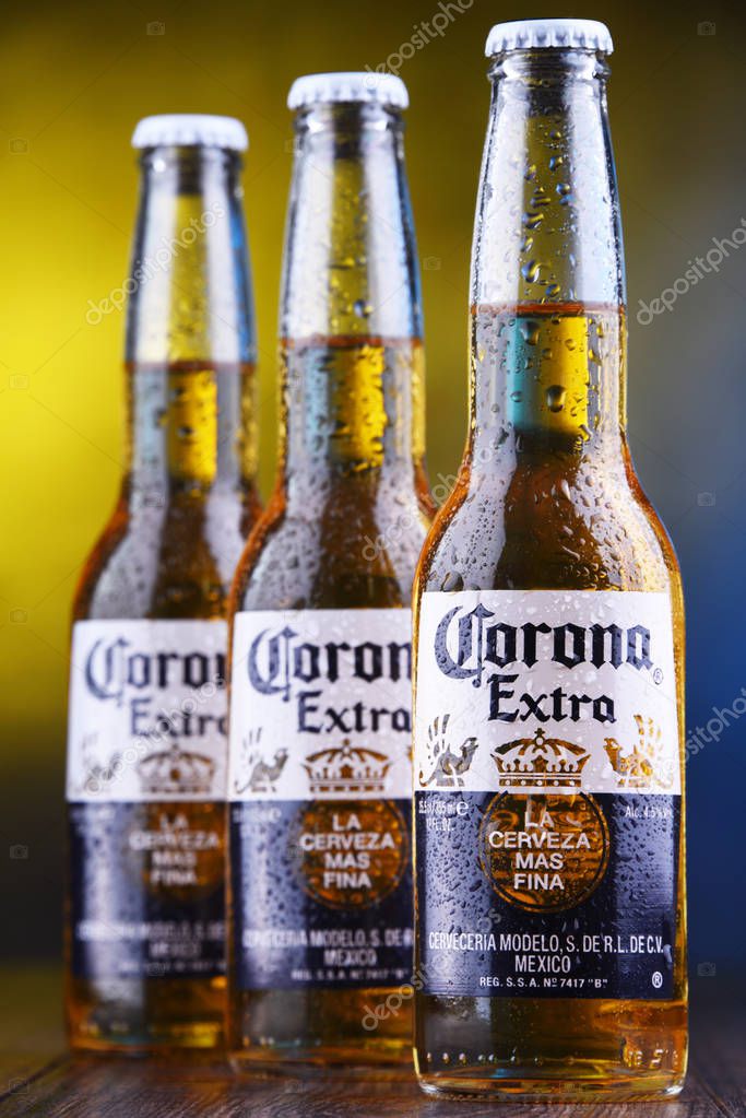 POZNAN, POL - MAR 28, 2019: Bottles of Corona Extra, one of the top-selling beers worldwide, a pale lager produced by Cerveceria Modelo in Mexico