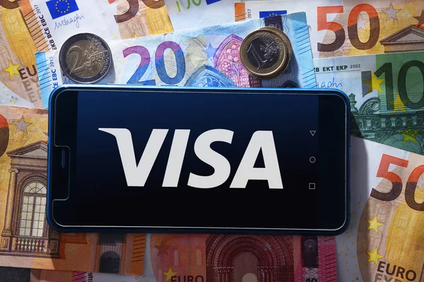 Euro currency and smartphone showing logo of Visa — Stock Photo, Image