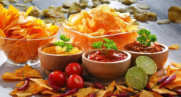 Composition with bowl of potato chips. Royalty Free Stock Photos