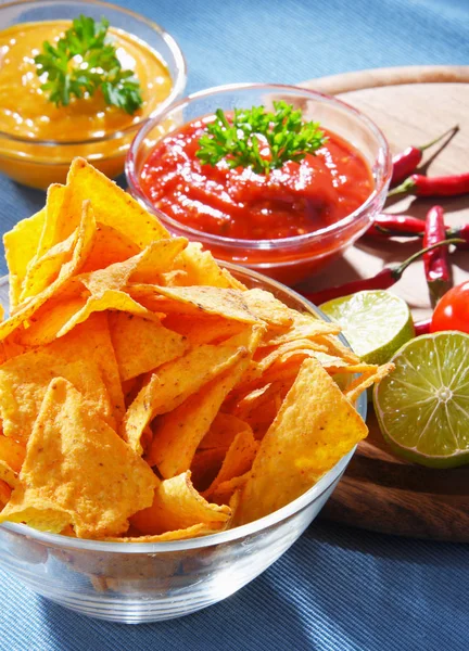 Composition with bowl of tortilla chips. — Stock Photo, Image