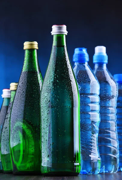 Different sorts of bottles containing mineral water — Stock Photo, Image