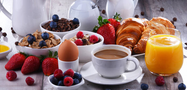 Breakfast served with coffee, juice, croissants and fruits