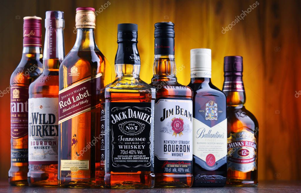 POZNAN, POLAND - JUL 5, 2019: Bottles of several global whiskey brands, the most popular liquor in the world.
